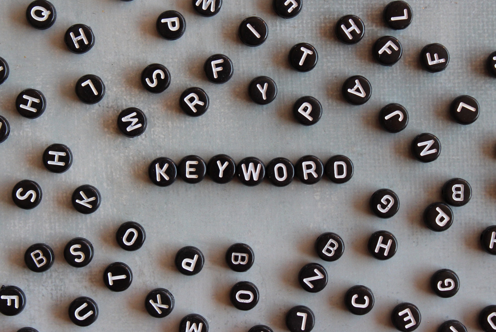 Alphabet beads with text KEYWORD