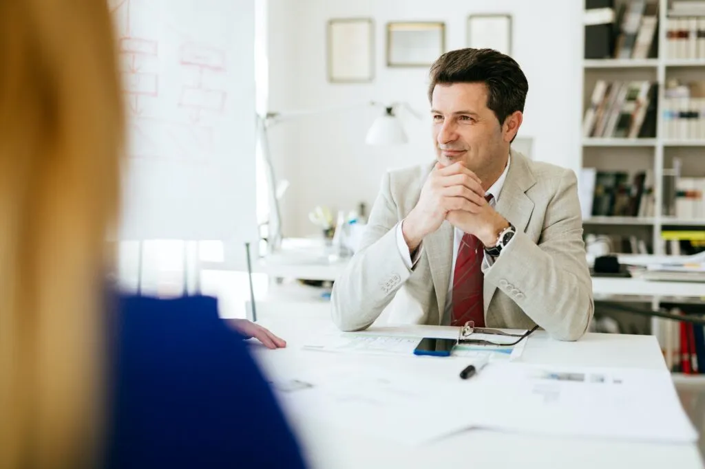 Company director sitting at table